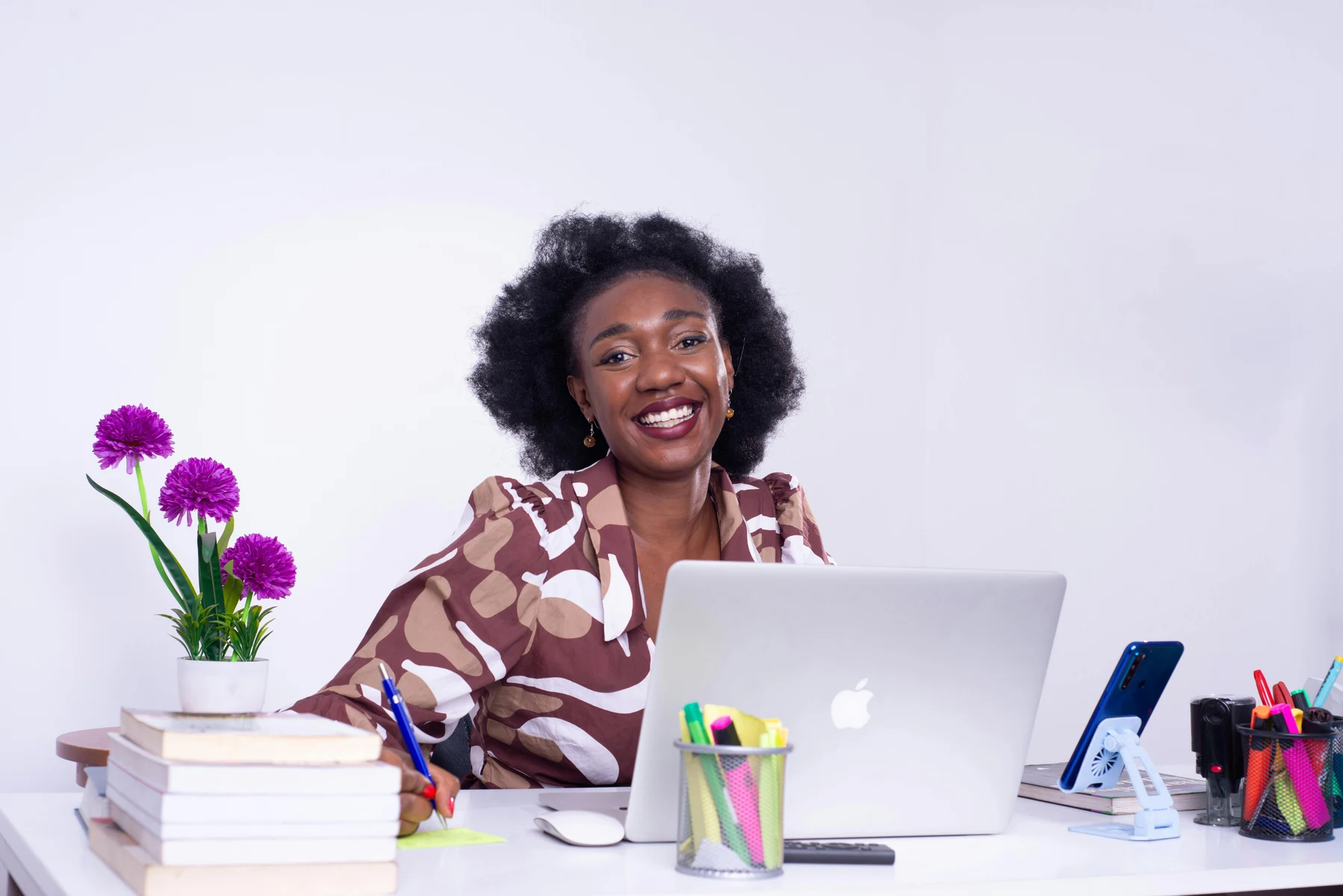 Smiling African woman at an office reception desk